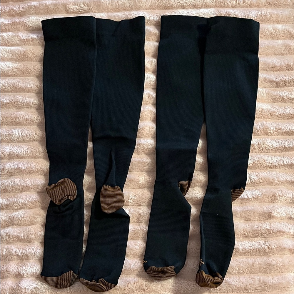 Two pair XS compression stockings. NWOT. Black w/ logo on top of toe. Women’s.